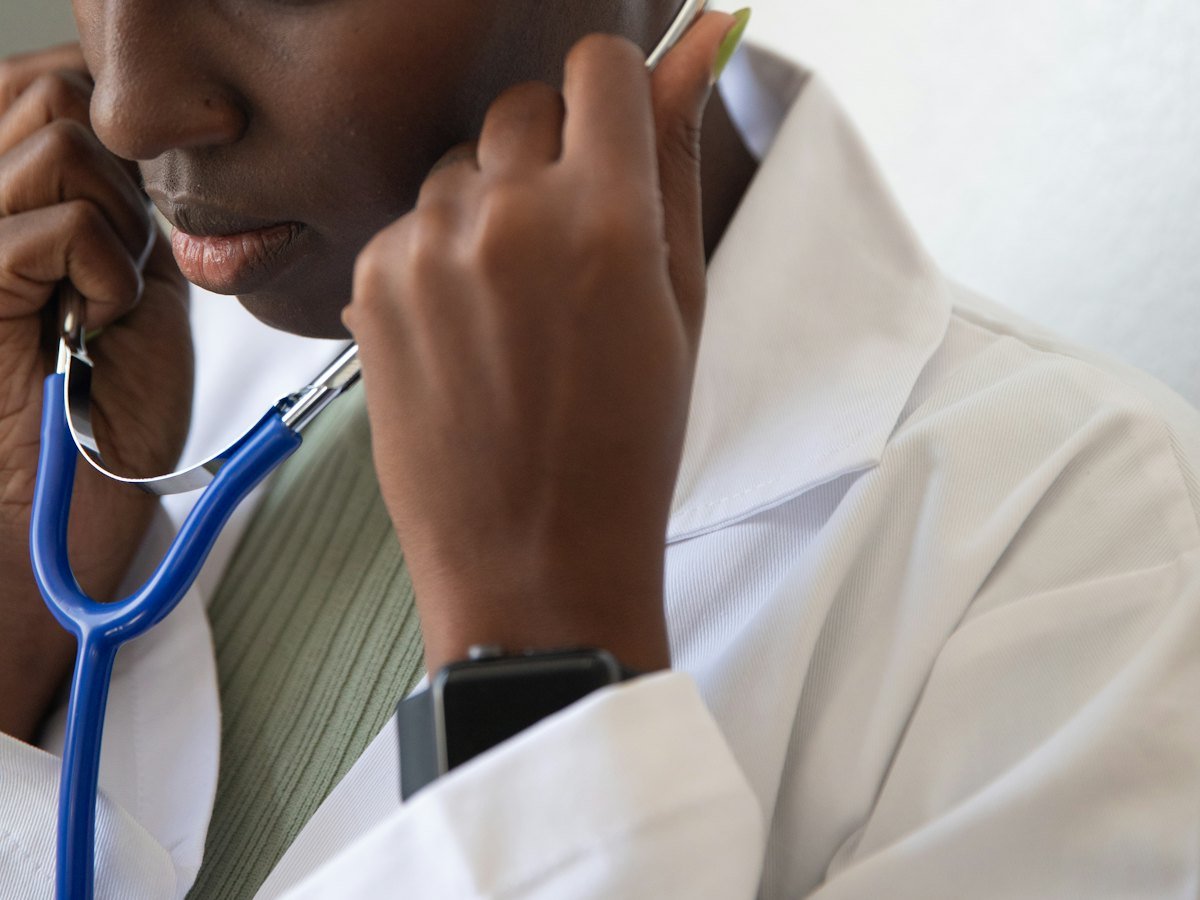 Clinician using a stethoscope